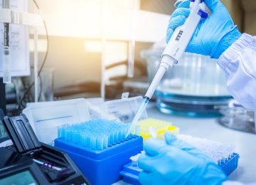 Instruments and scientific equipment. Scientists are using a micropipette to suck the solution for scientific experiments.